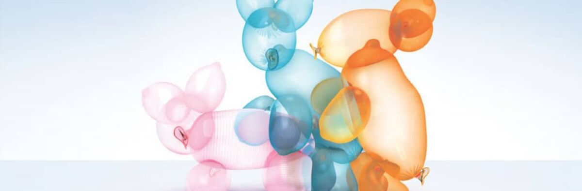 Condom animal balloons having a threesome
