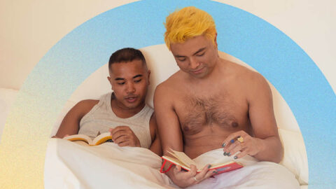 Asian couple read books in bed with blue yellow circle around