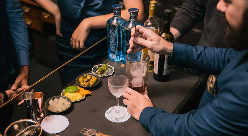 bartender stirs a cocktail at eau de vie melbourne