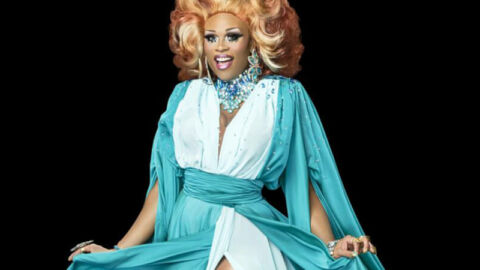 ru paul drag queen in white and blue dress