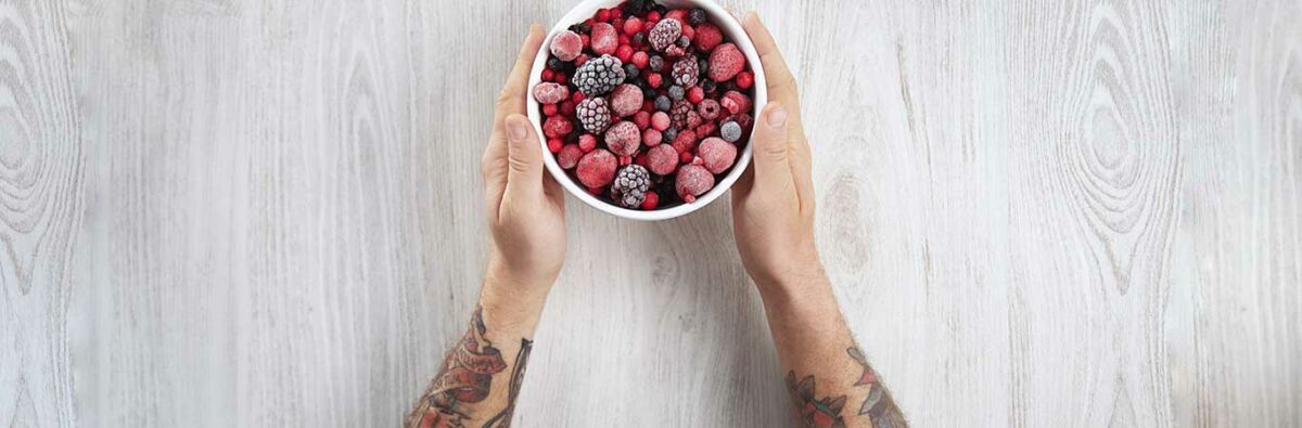 Man holding a bowl of berries