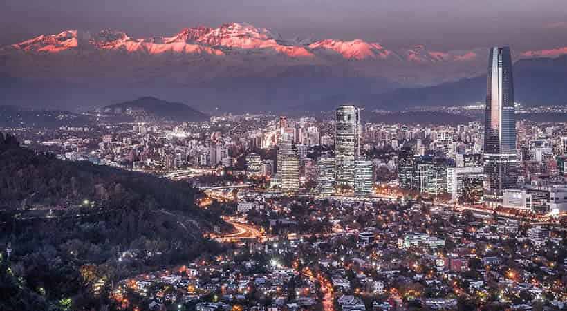 Santiago city skyline with snow on mountains in background