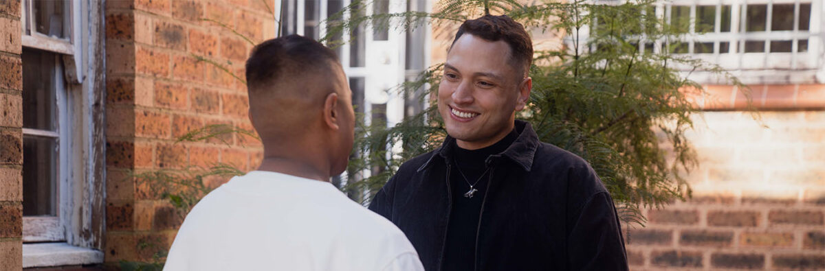 colombian-man-smiling-at-date-oustide