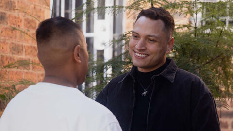 colombian-man-smiling-at-date-oustide