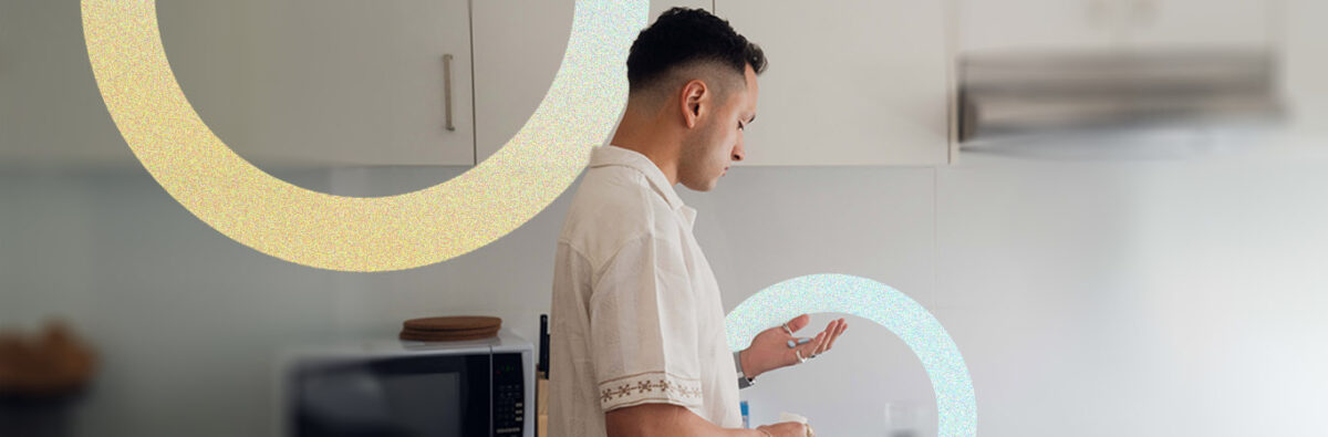 mid-shot-colombian-man-holds-single-pill-yellow-blue-circles