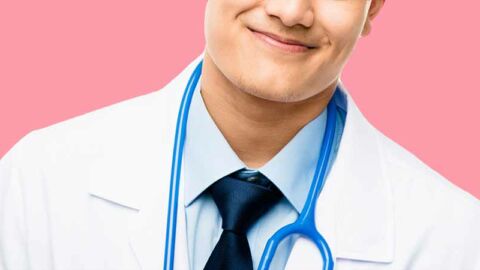 handsome smiling doctor with blue stethoscope