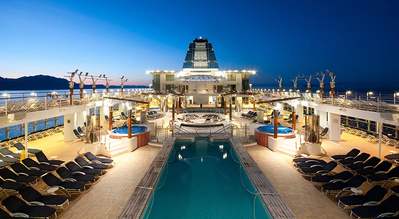 cruise ship sailing at dusk