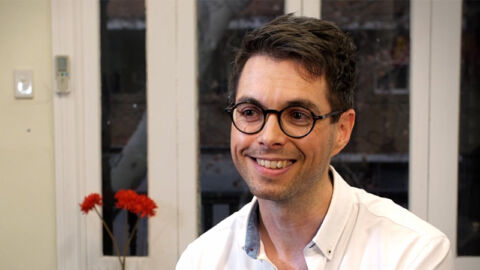 Doctor Vincent wearing glasses smiling
