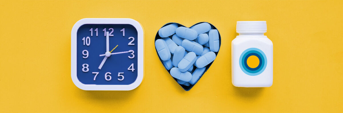 clock prep pills in heart shaped container pill bottle on yellow background
