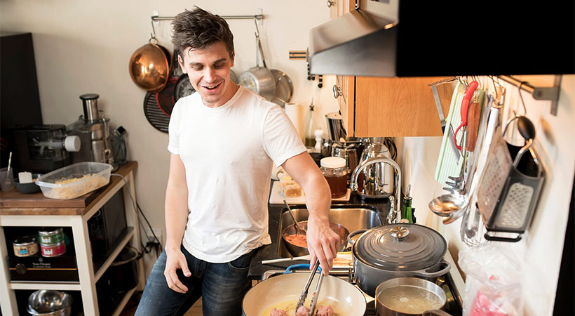 Antoni Porowski from queer eye cooking meatballs at home