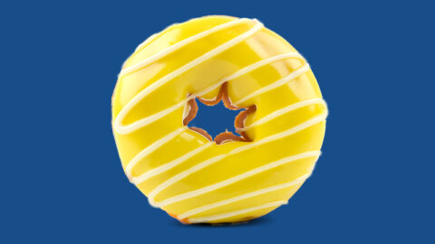 yellow glazed donut on blue background