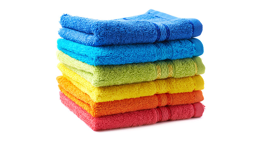 stack of brightly coloured rainbow towels