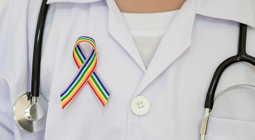 doctor with stethoscope and rainbow ribbon gay friendly lgbt healthcare