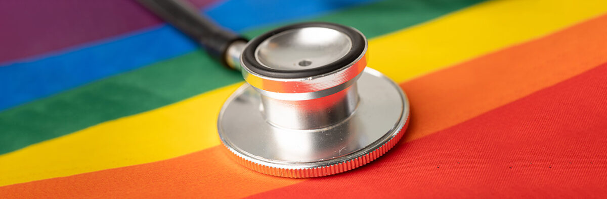 stethoscope on rainbow flag gay friendly doctor lgbt health