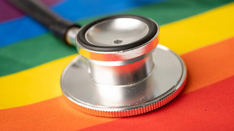 stethoscope on rainbow flag gay friendly doctor lgbt health