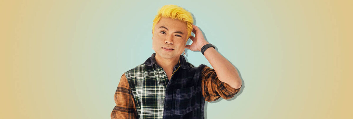 Vietnamese man confused on blue yellow background
