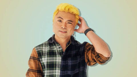 Vietnamese man confused on blue yellow background