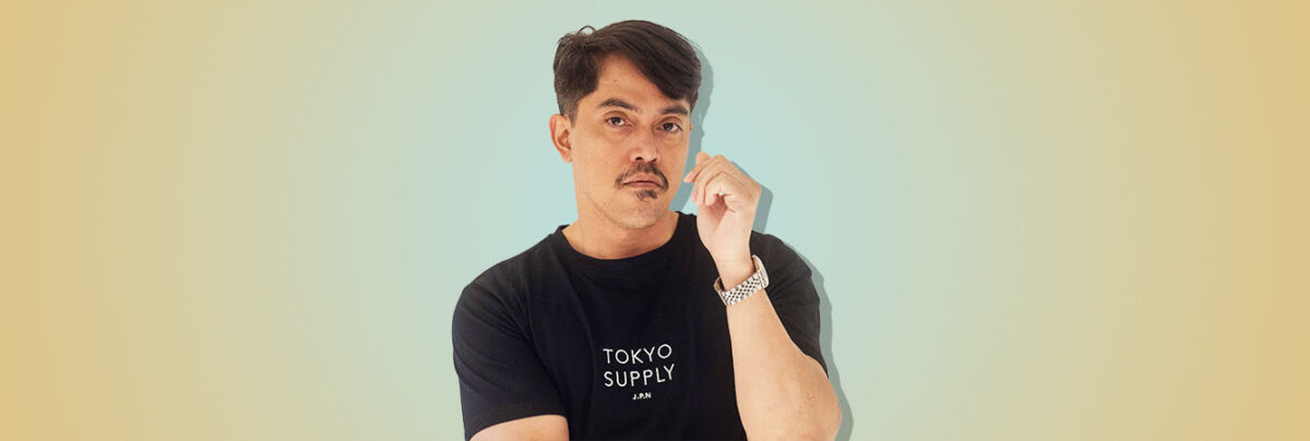 South East Asian man on yellow blue background