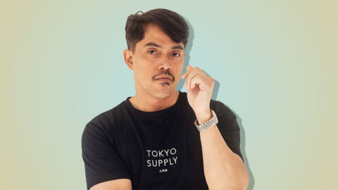 South East Asian man on yellow blue background