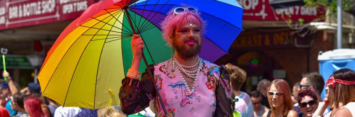drag queen holding rainbow umbrella at melbourne pride march