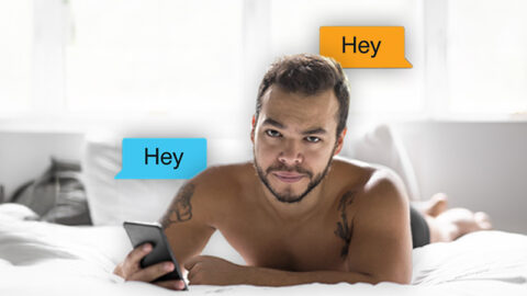 shirtless-mexican-man-in-bed-with-phone-hey-grindr-messages-hero