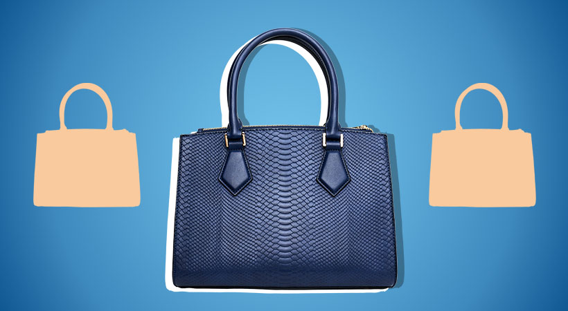 Navy blue and orange bags on blue background