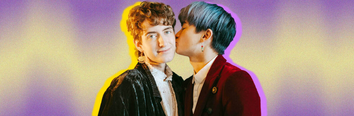 Blue haired Asian man kissing white non-vbinary person on cheek, on purple and yellow background