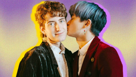 Blue haired Asian man kissing white non-vbinary person on cheek, on purple and yellow background