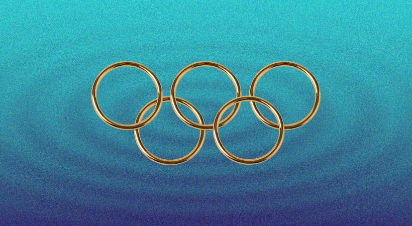 Five gold metal rings on blue ripple background