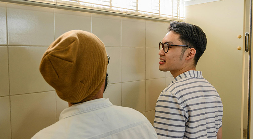 two-asian-guys-cruising-in-toilet