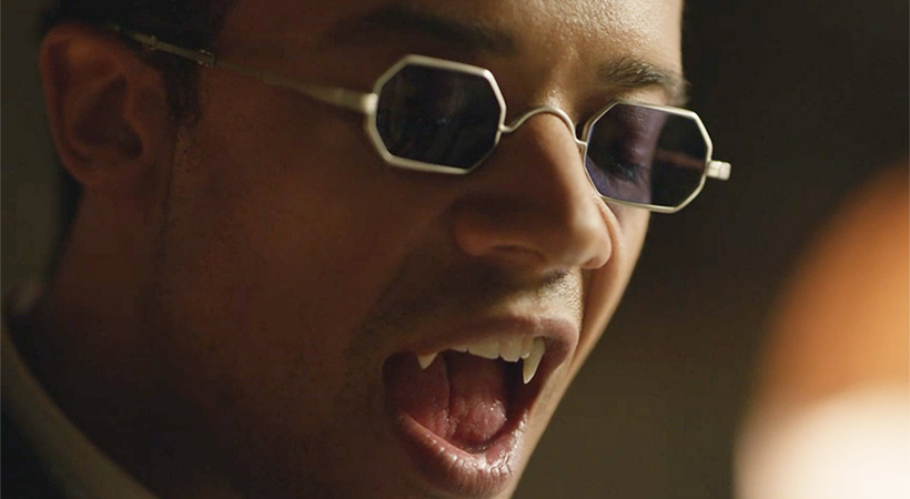 Louis from Interview with a Vampire with glasses and fangs out