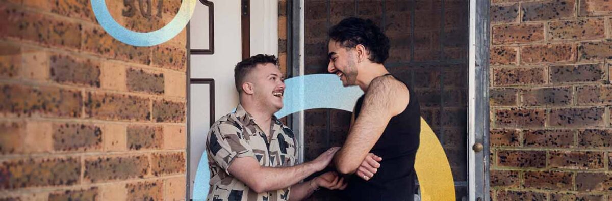 Middle eastern couple entering house, with yellow and blue graphic circles