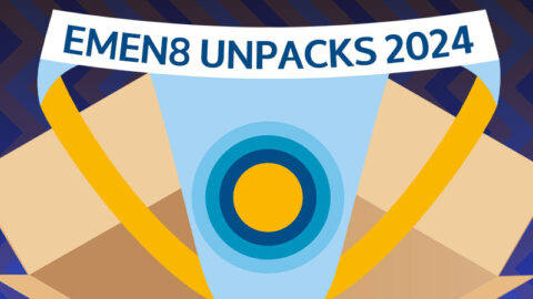 Blue and yellow Emen8 branded jockstrap, in cartoon box, on textured wrapping paper background