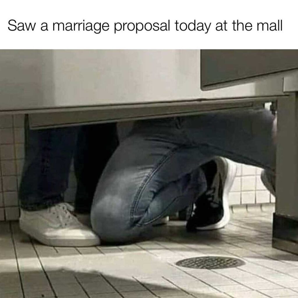 Meme of two men under toilet stall