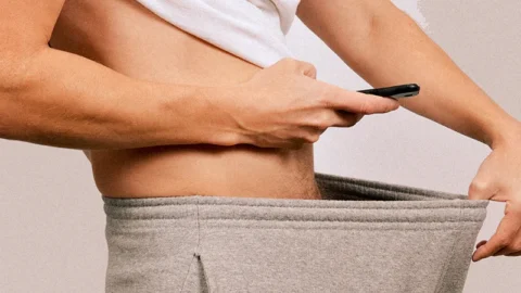 white man taking a photo of his dick