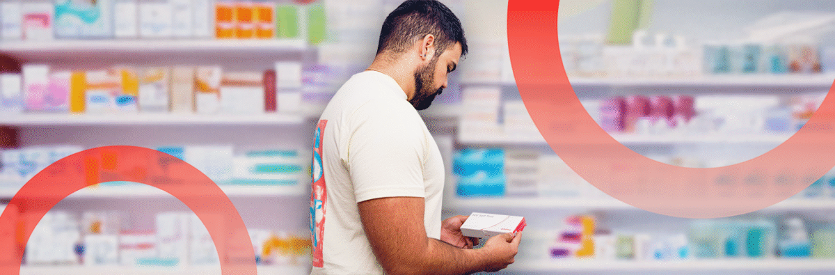 venezuelan-man-holding-self-testing-kit-at-pharmacy