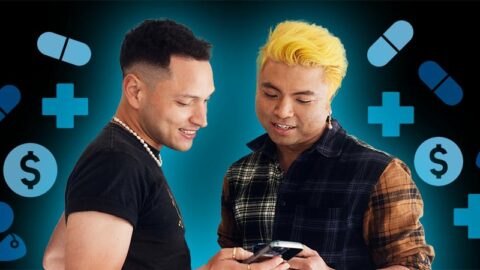 Colombian and Cambodian men look at phone on black background with blue health icons surrounding
