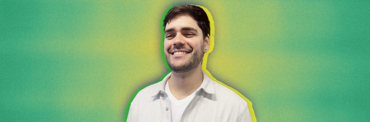 Brazilian man smiling on green and yellow background
