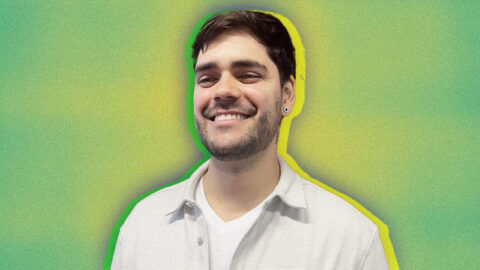 Brazilian man smiling on green and yellow background
