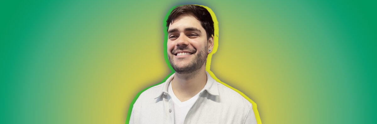 Brazilian man smiling on green and yellow background