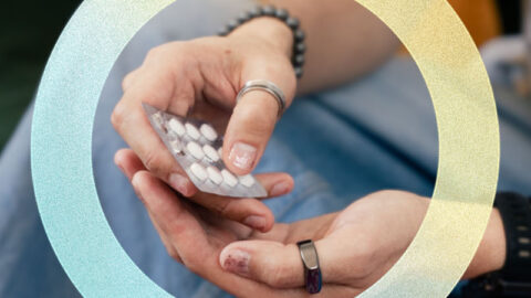 Man with nailpolish holding doxy-PEP pills, yellow and blue circle element around